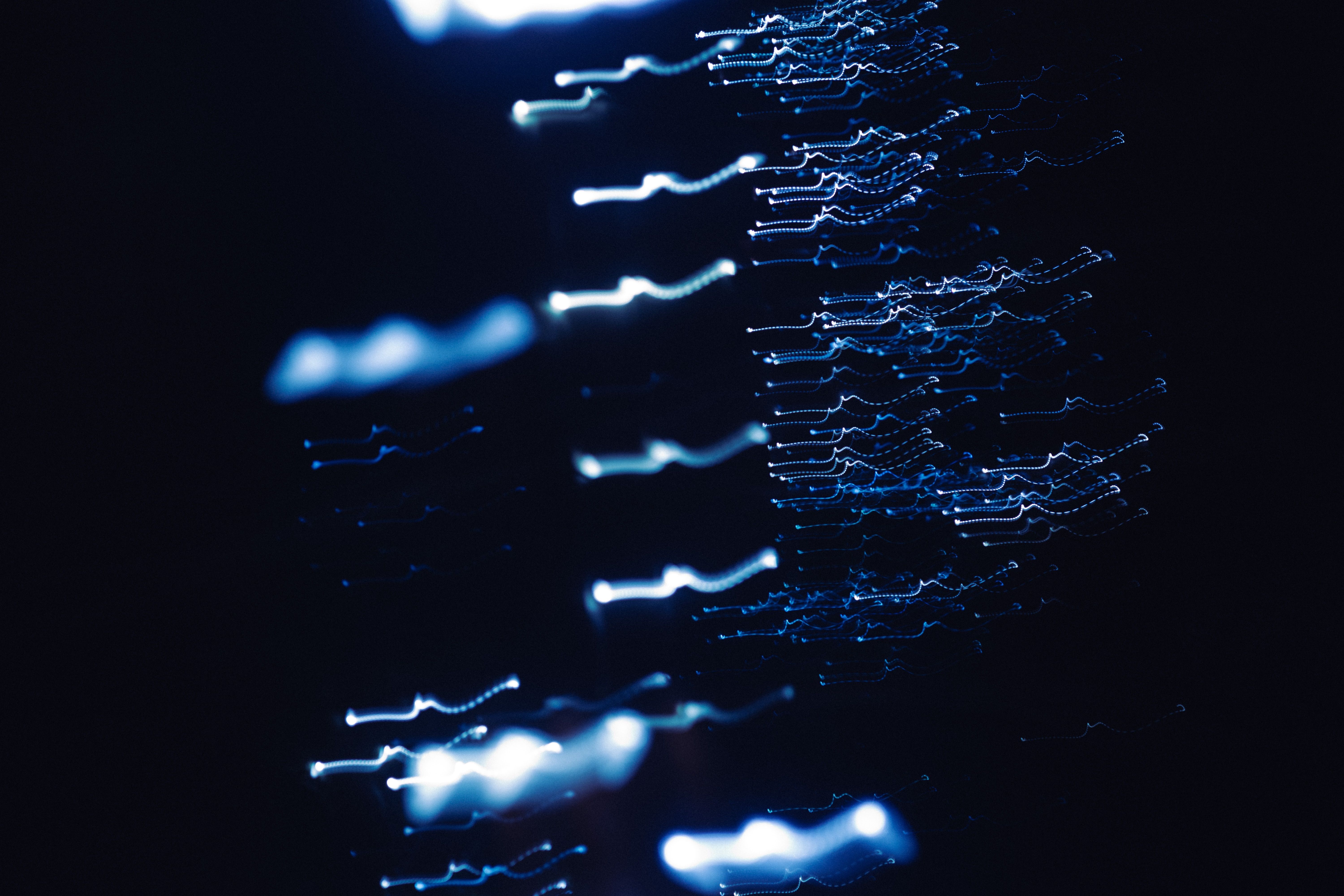 Glowing cybernetic data particles and network nodes representing conversion analytics
