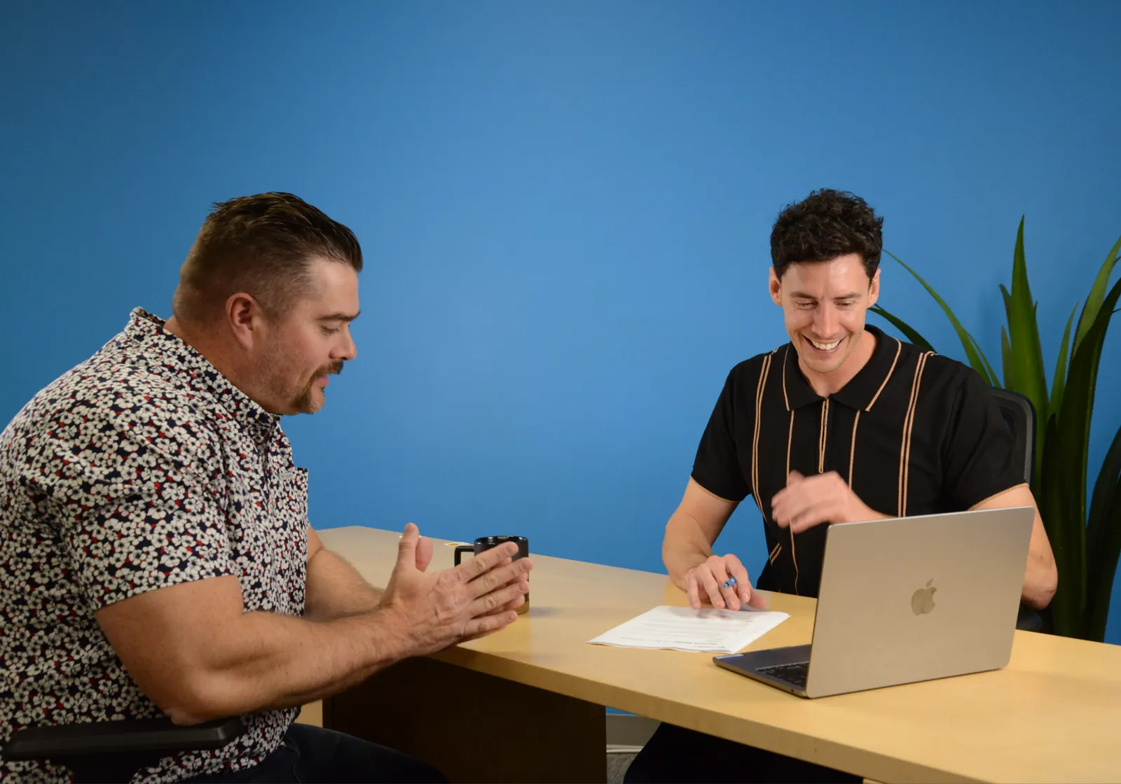 Two colleagues planning a campaign at a laptop