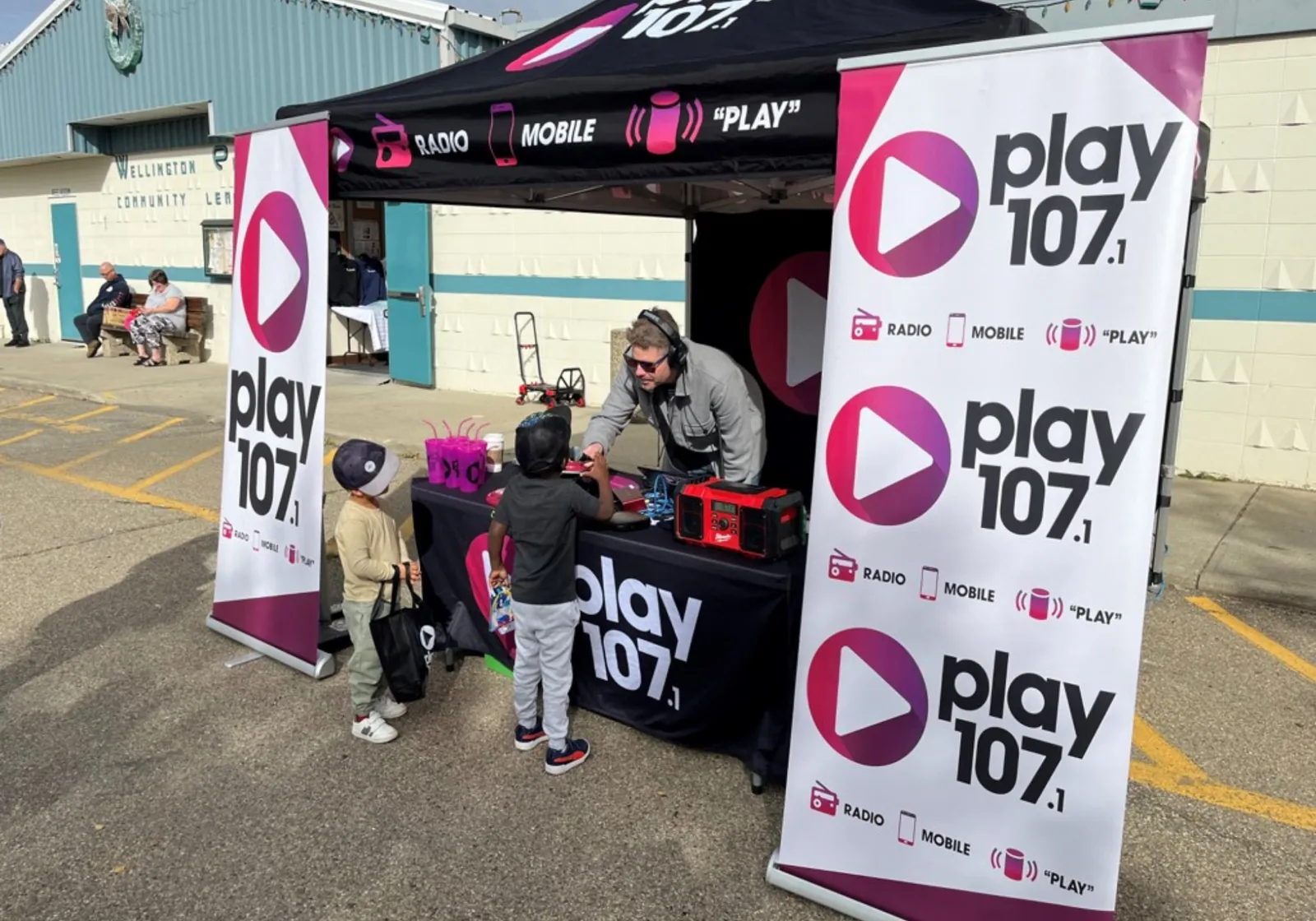 play 107 booth at an outdoor community event