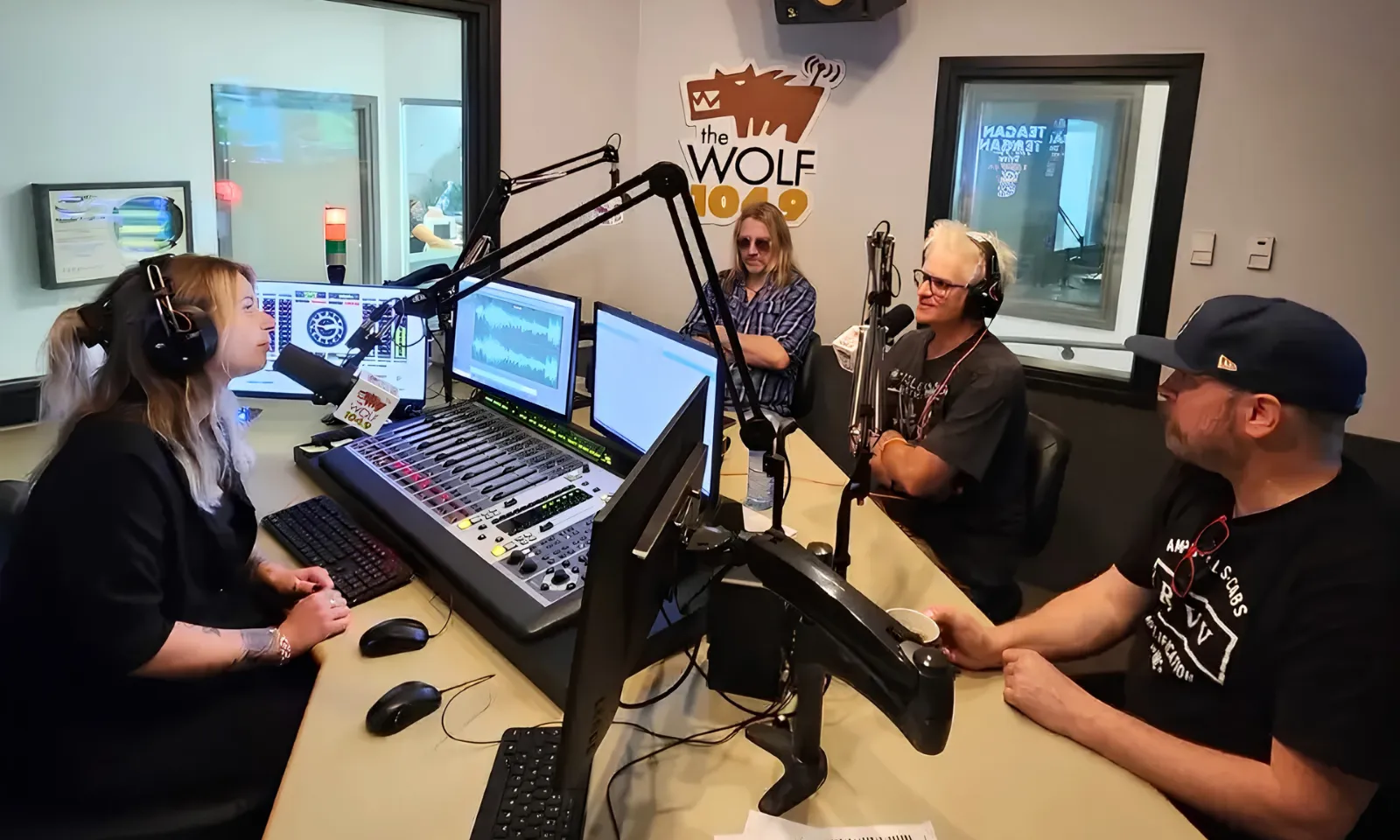Hosts on air in The Wolf 104.9 radio studio