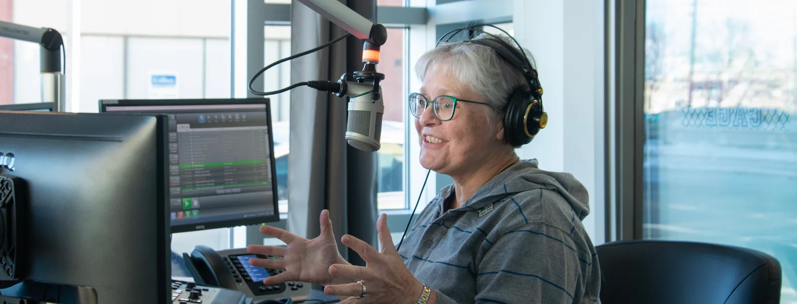 620 CKRM host on air in the studio
