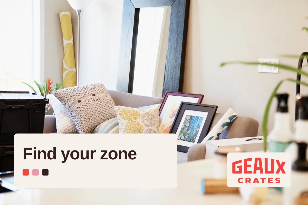 Sofa and moving crates in a bright living room, paired with “Find your zone,” colored squares, and the Geaux Crates logo.
