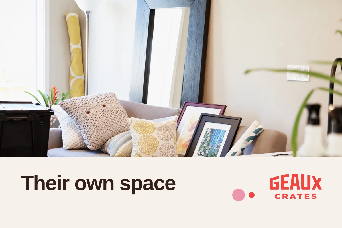 Bright furnished living room with actual crates, “Their own space,” and the Geaux Crates logo; no people shown.