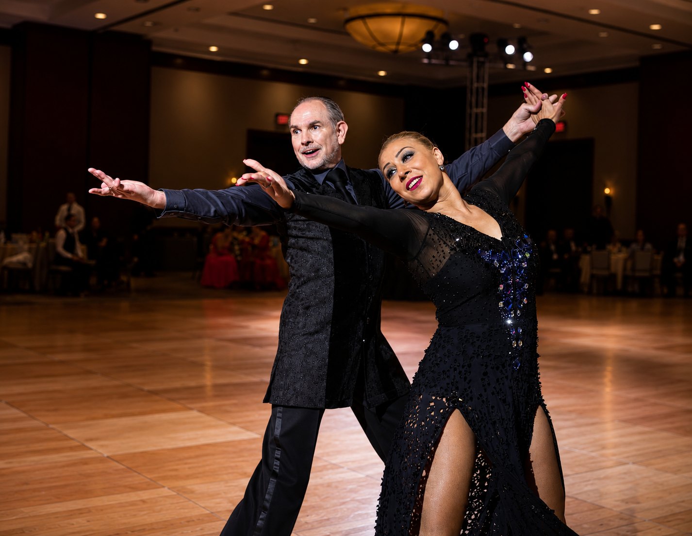 Ballroom couple performing on the floor