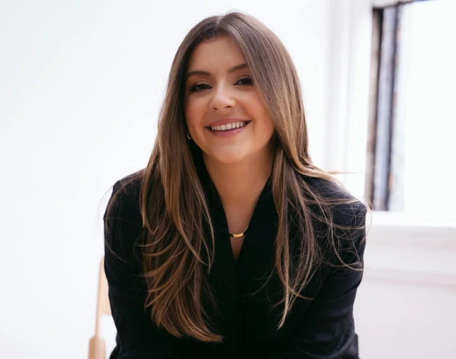 Giulia Guerrieri smiling in a black blazer