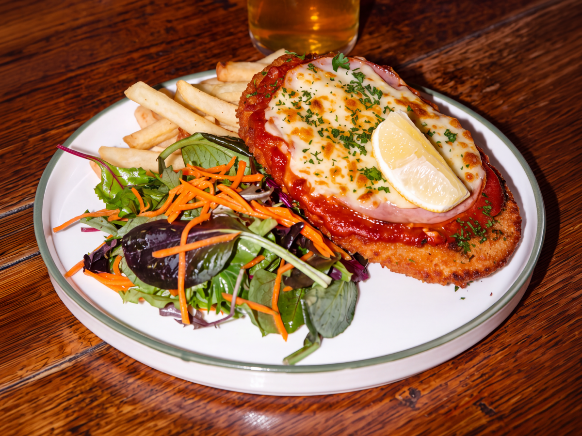 Chicken parmi with chips and salad