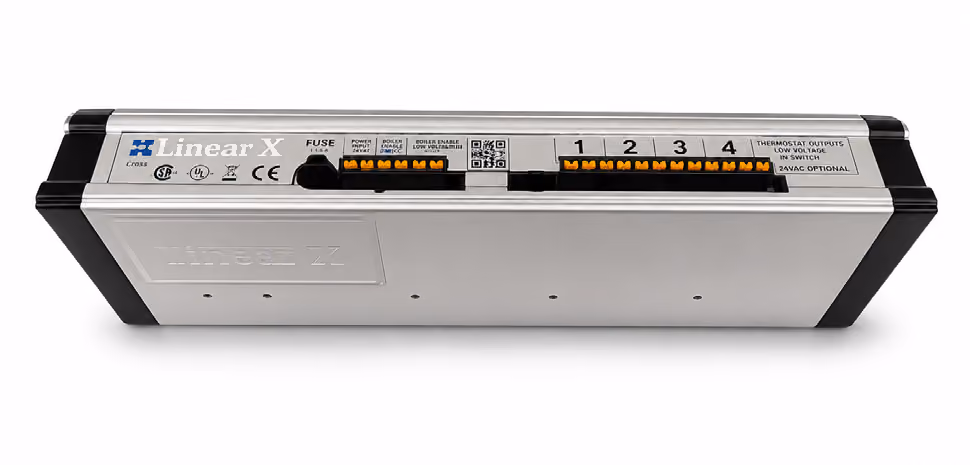 Linear X electronic device with numbered terminal blocks and labels for fuse and thermostat outputs.