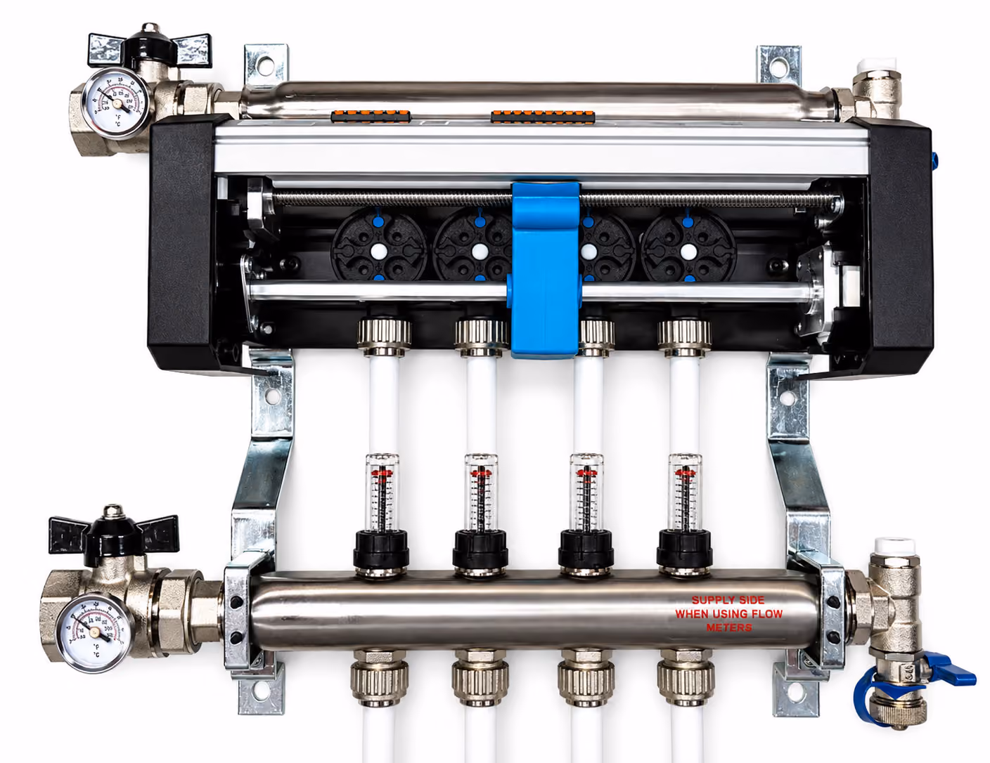Metal plumbing manifold with four white pipes, flow meters, pressure gauges, and valves for fluid control.