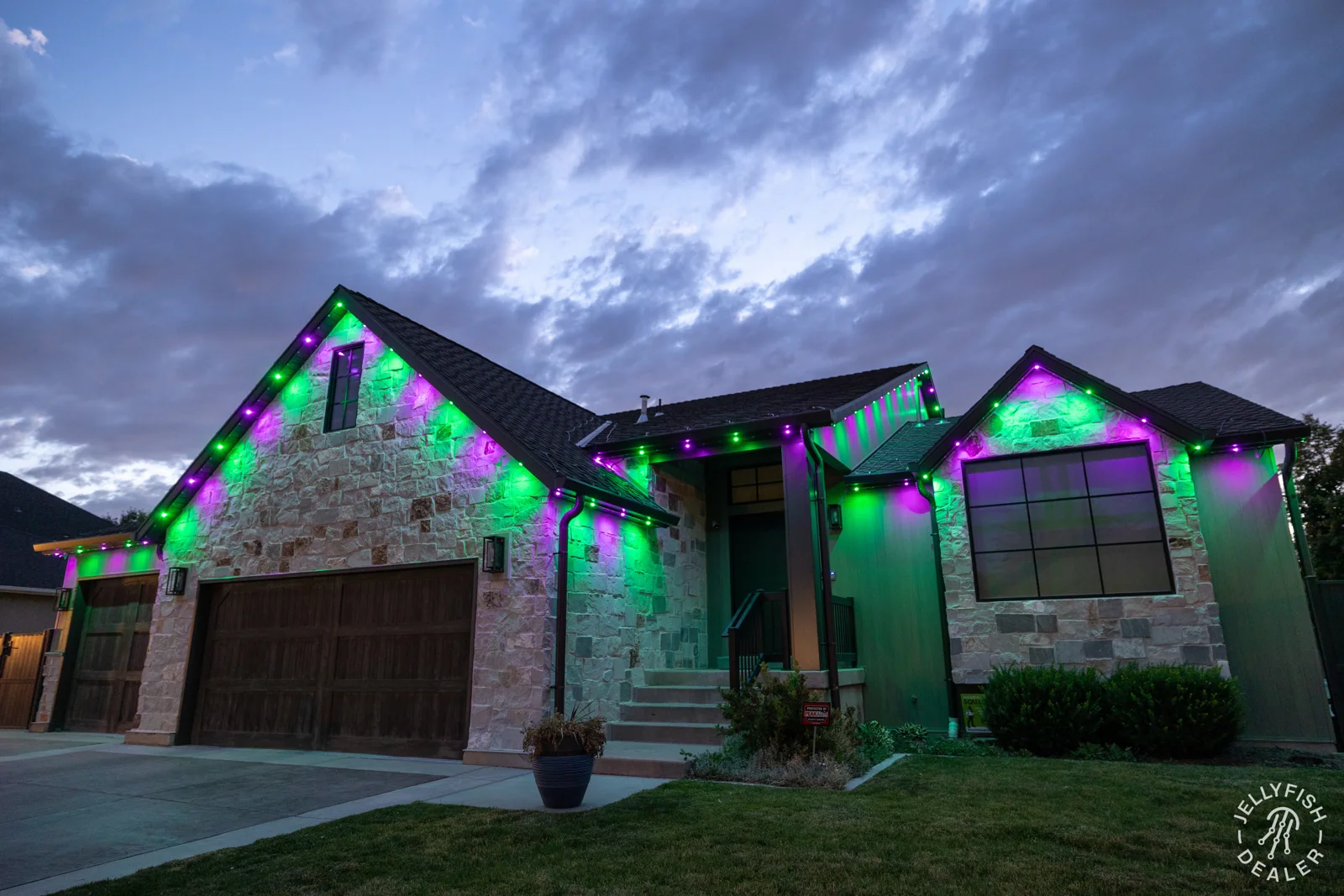 Purple and green Halloween lighting on a home.