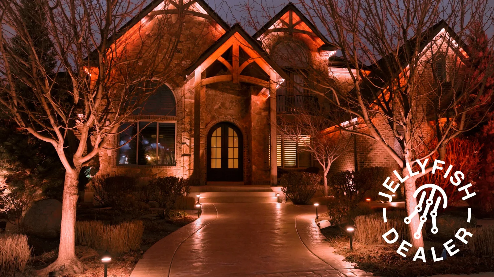 Warm landscape lighting along a garden walkway.