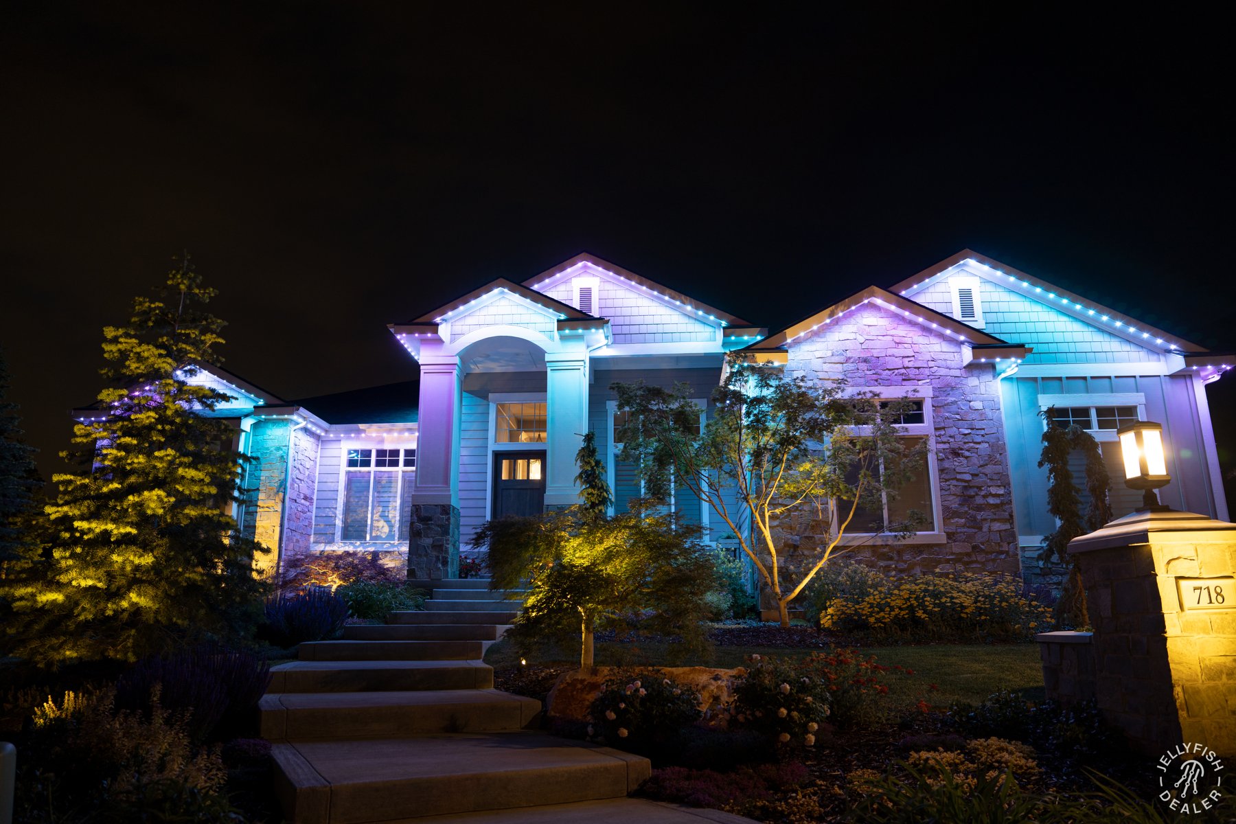 Soft pastel lighting along a home and garden entrance.