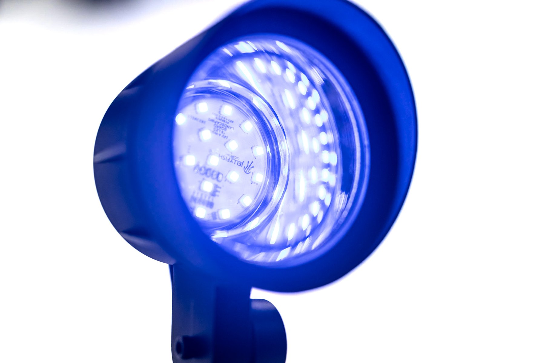 A JellyFish directional spotlight with its LED face illuminated.