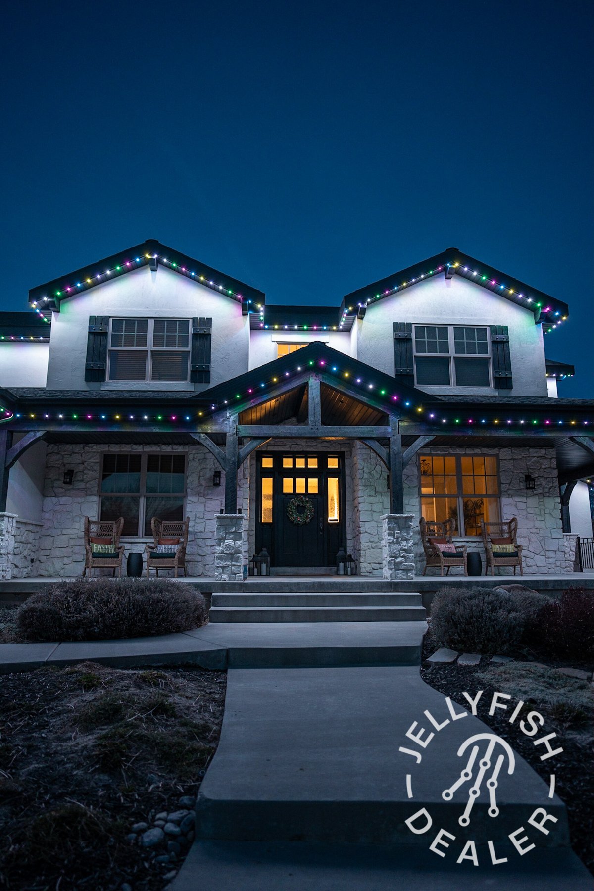 Blue and white roofline lighting on a two-story home.