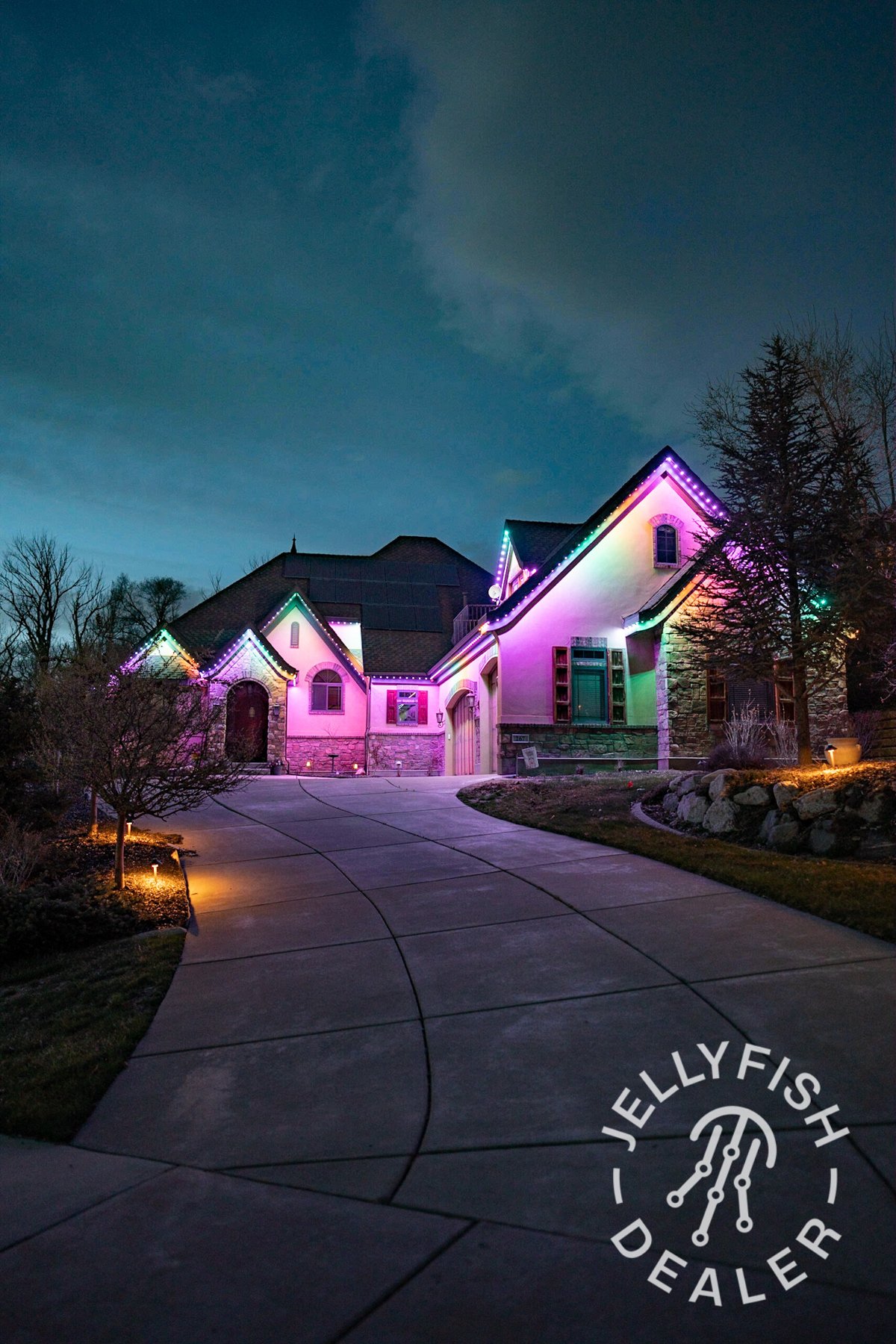 Pink and multicolor lighting around a front entrance.