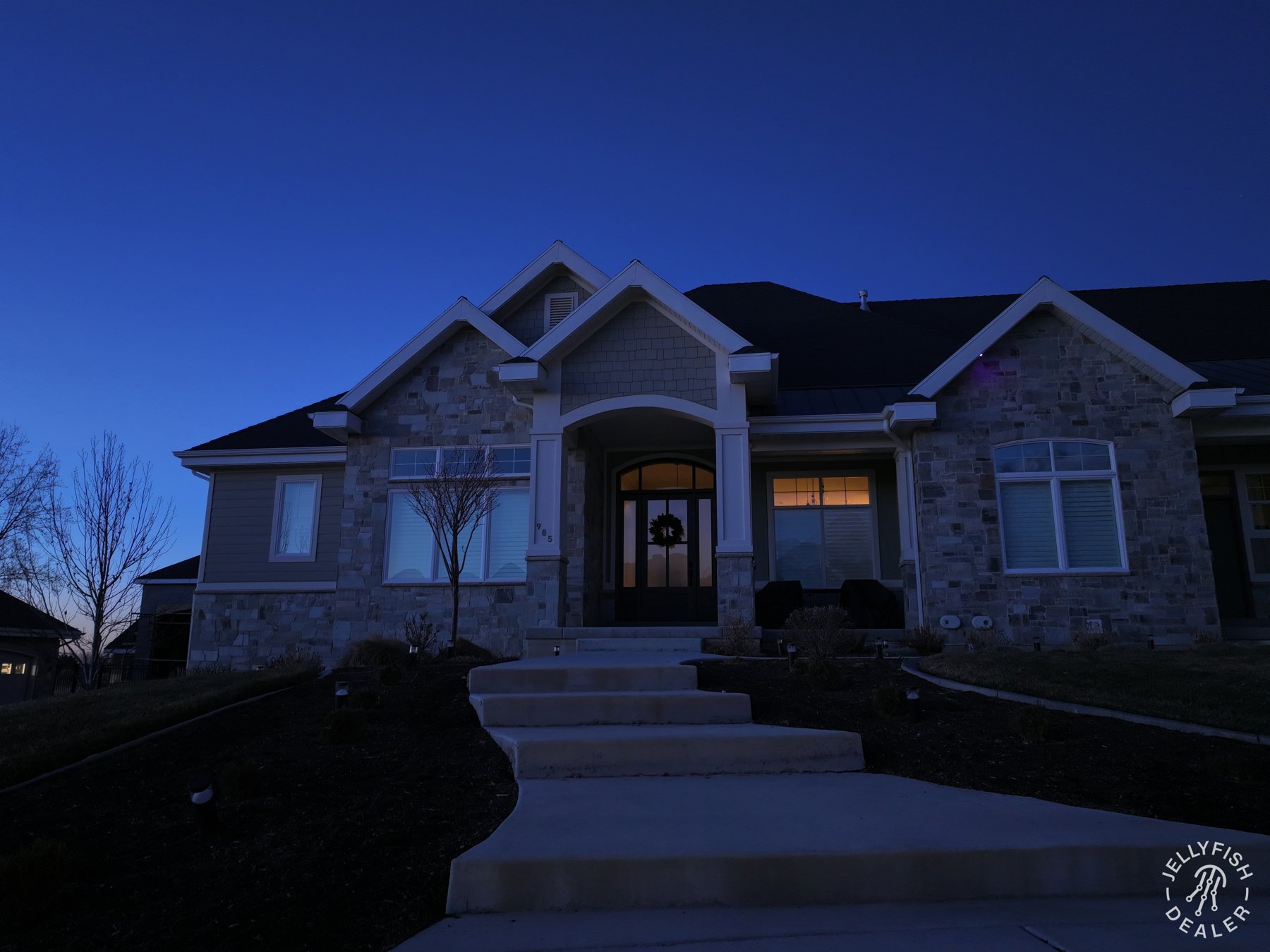 The same home at dusk with its decorative lighting switched off.
