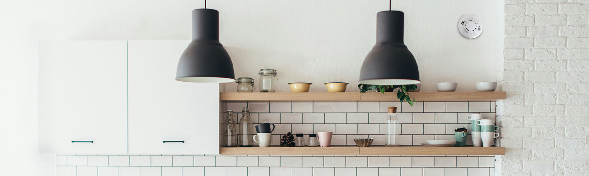 Residential kitchen with ceiling-mounted smoke detection.