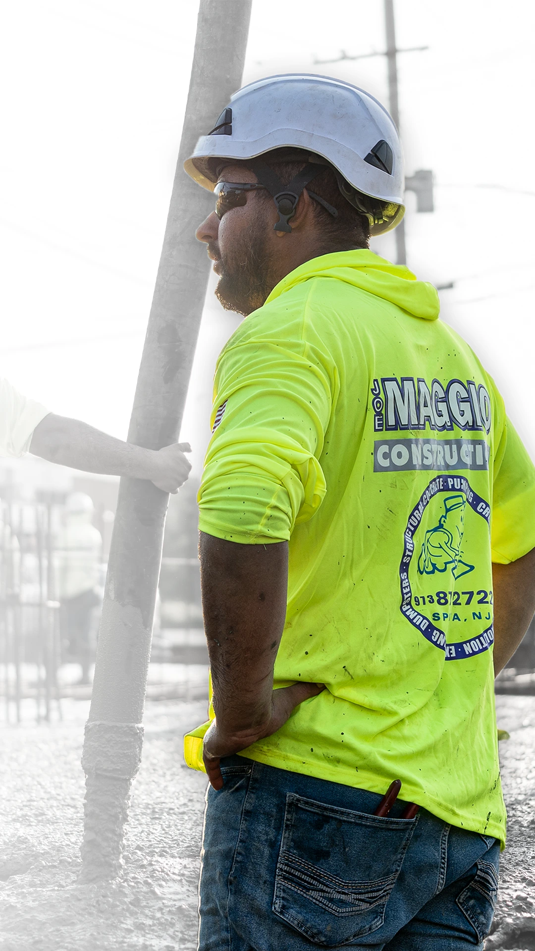 Joe Maggio Construction team member overseeing a structural concrete slab pour on a commercial project in New Jersey.