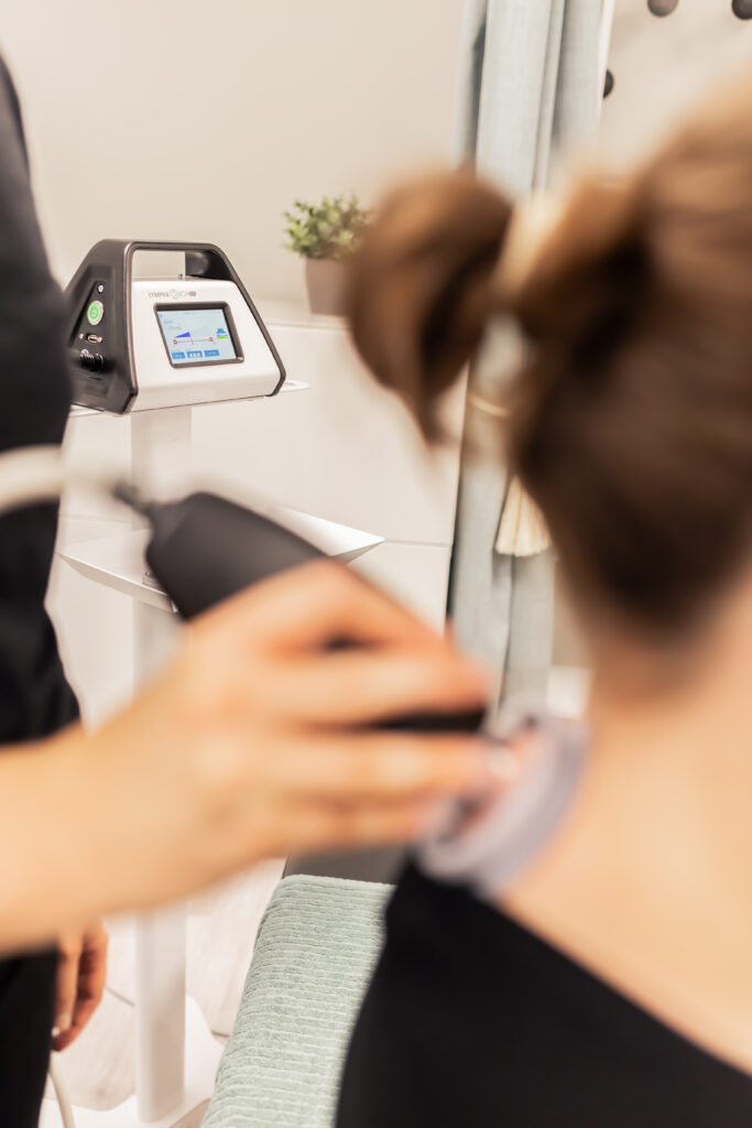 LymphaTouch used on the upper back during a women's health physiotherapy session