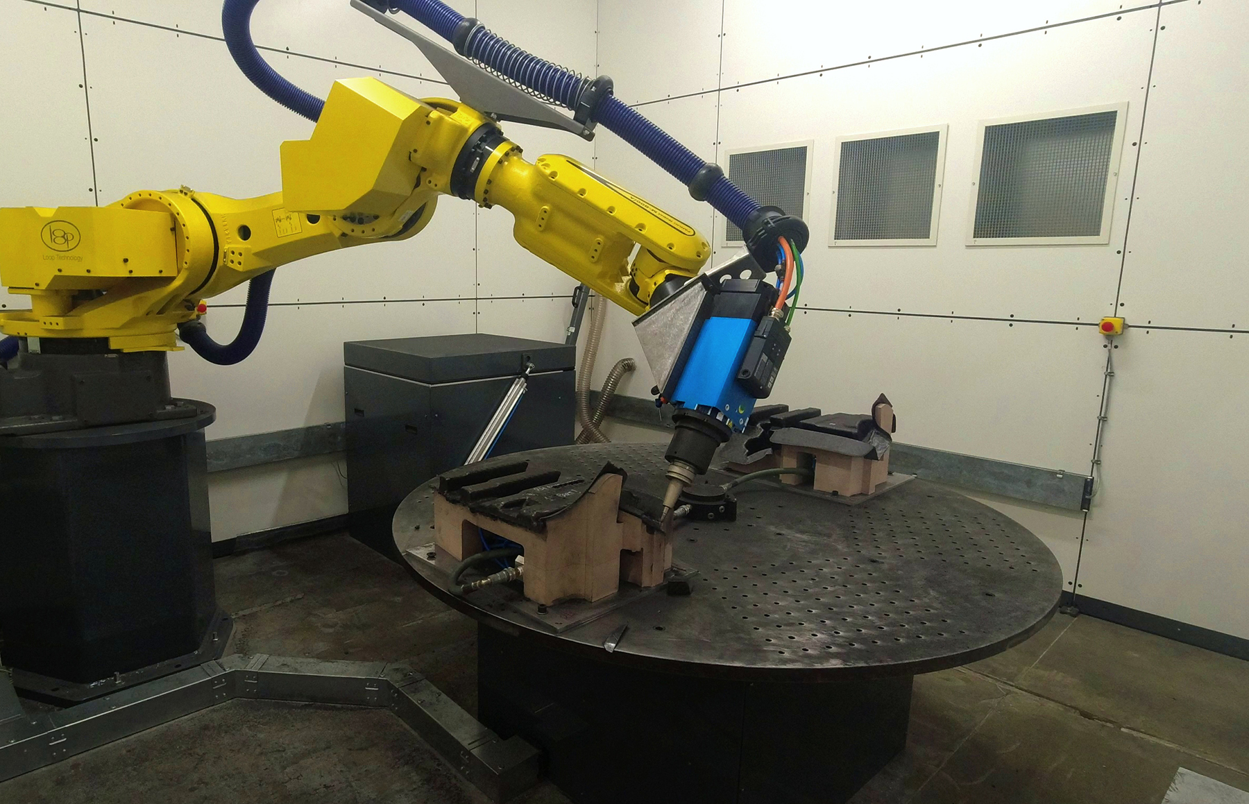 image of assembly line with robotic arms