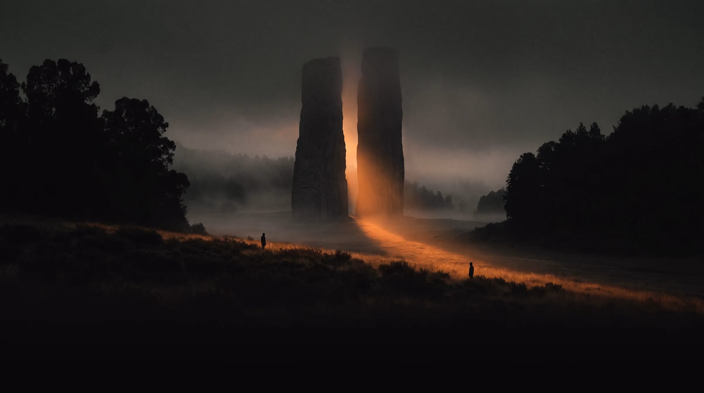 A path of light through a misty field at dusk