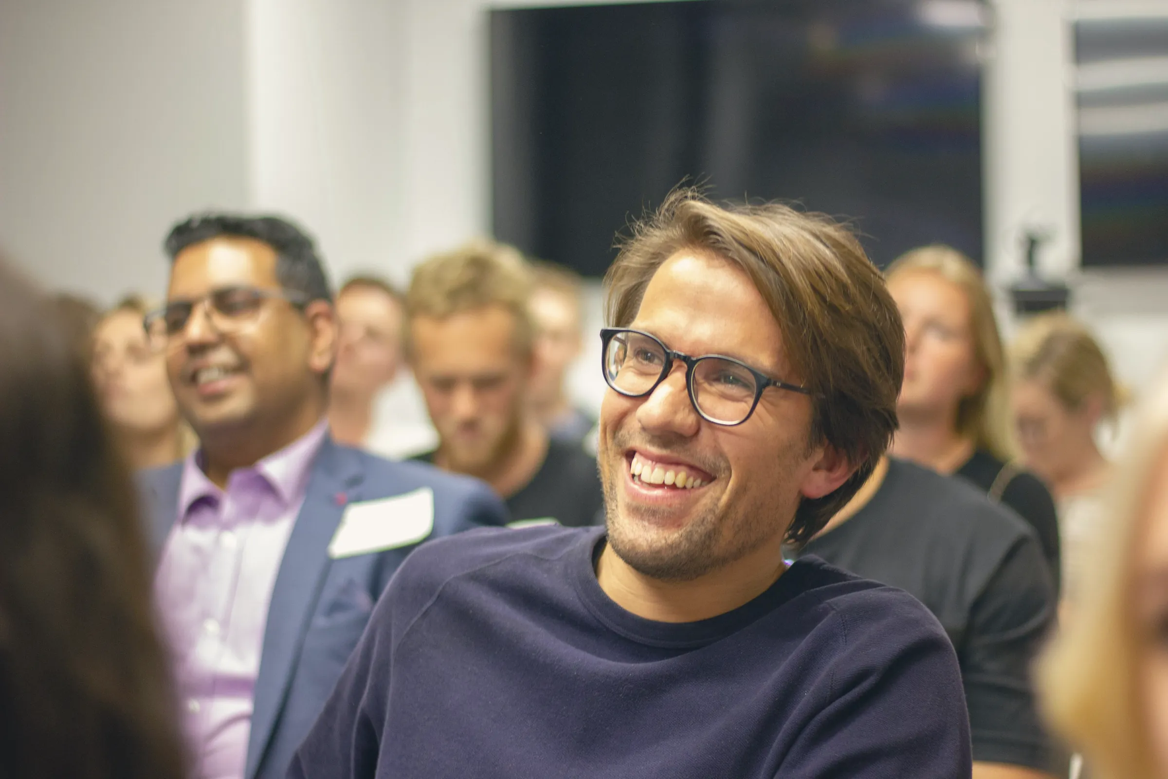 Smiling audience at a staff event