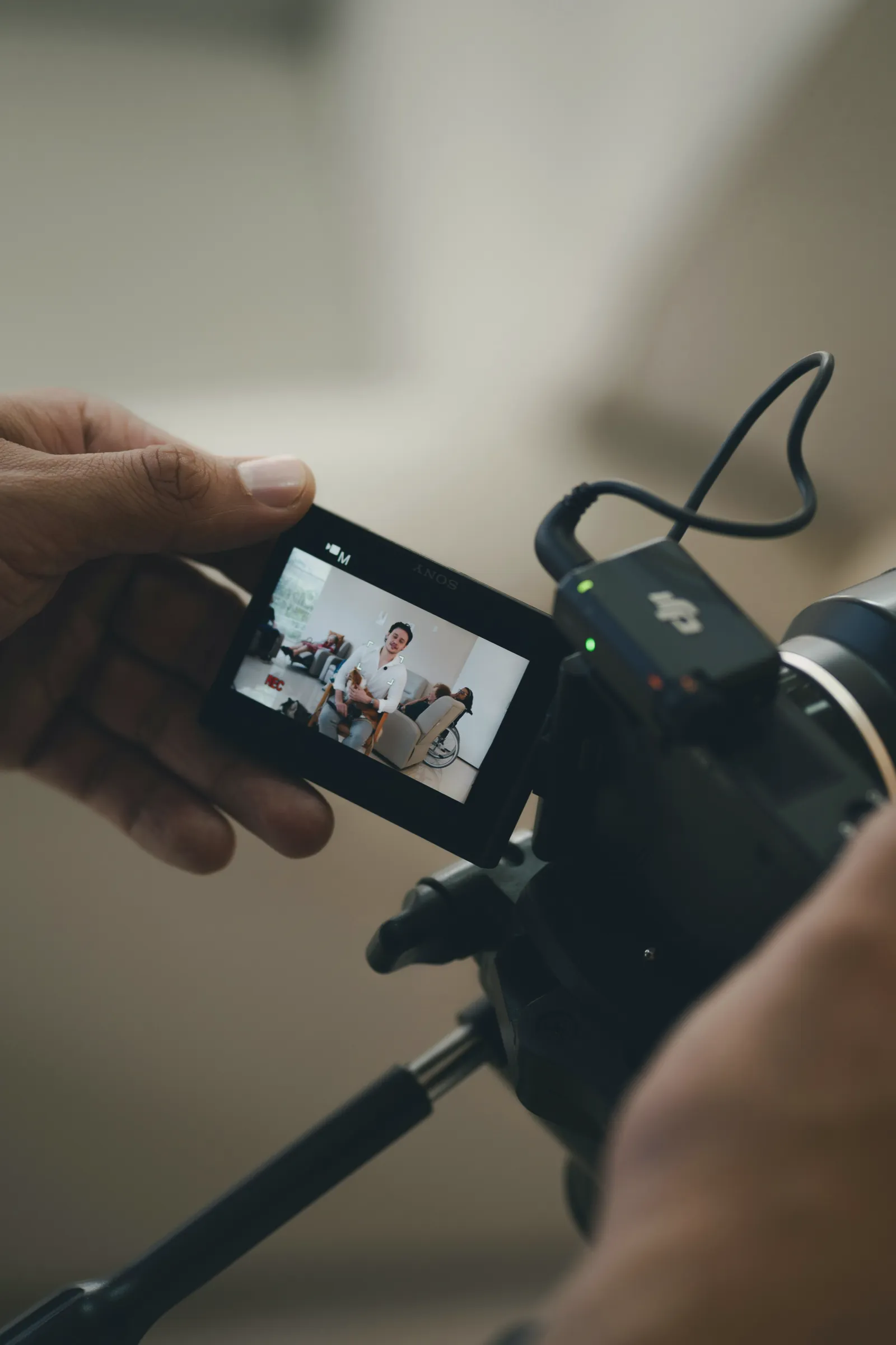 Camera screen showing an employee interview being filmed