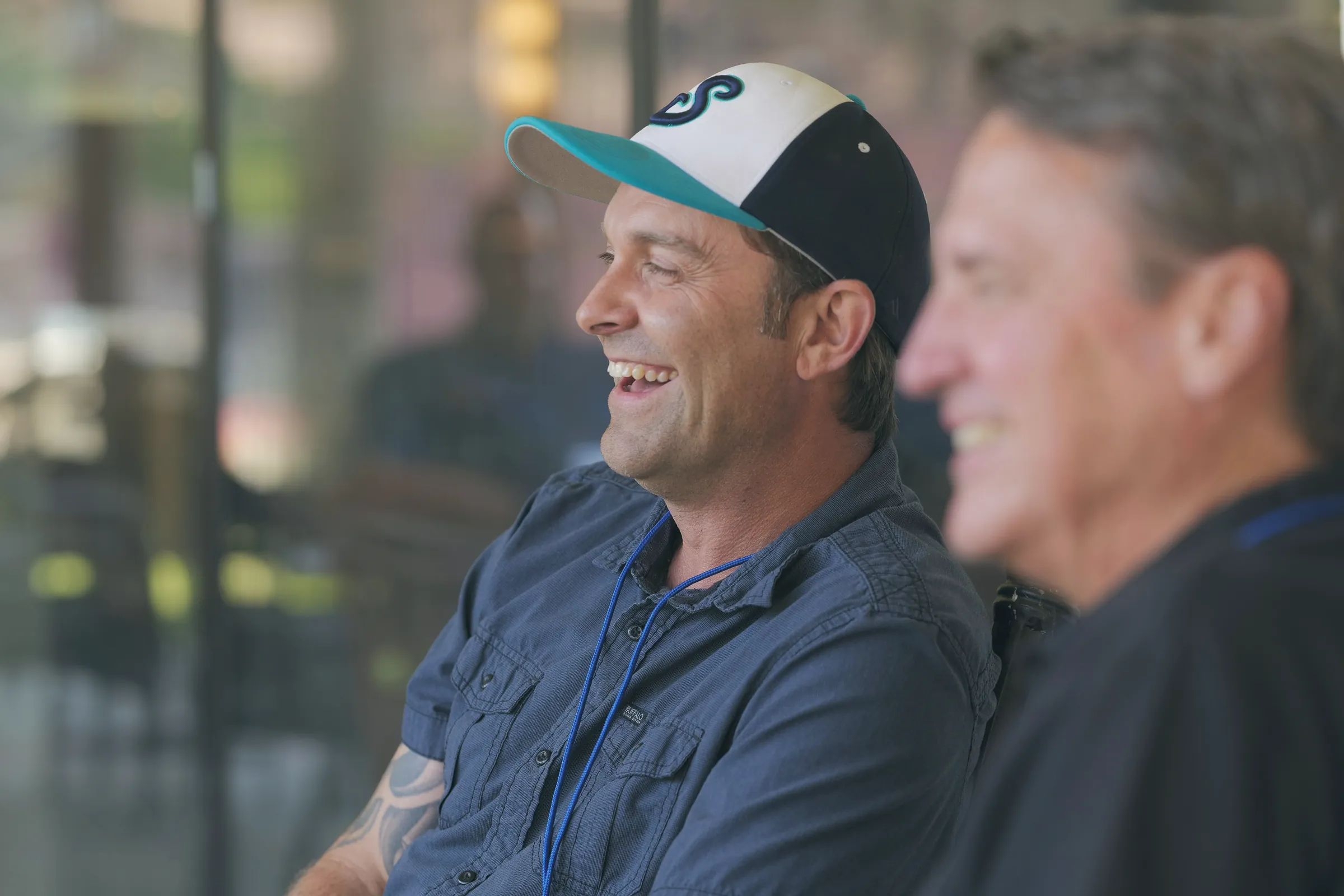 Two men laughing at an event