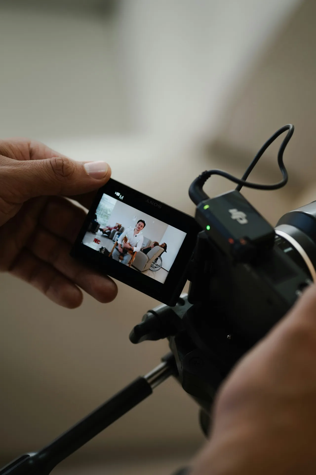Camera screen showing an employee interview being filmed