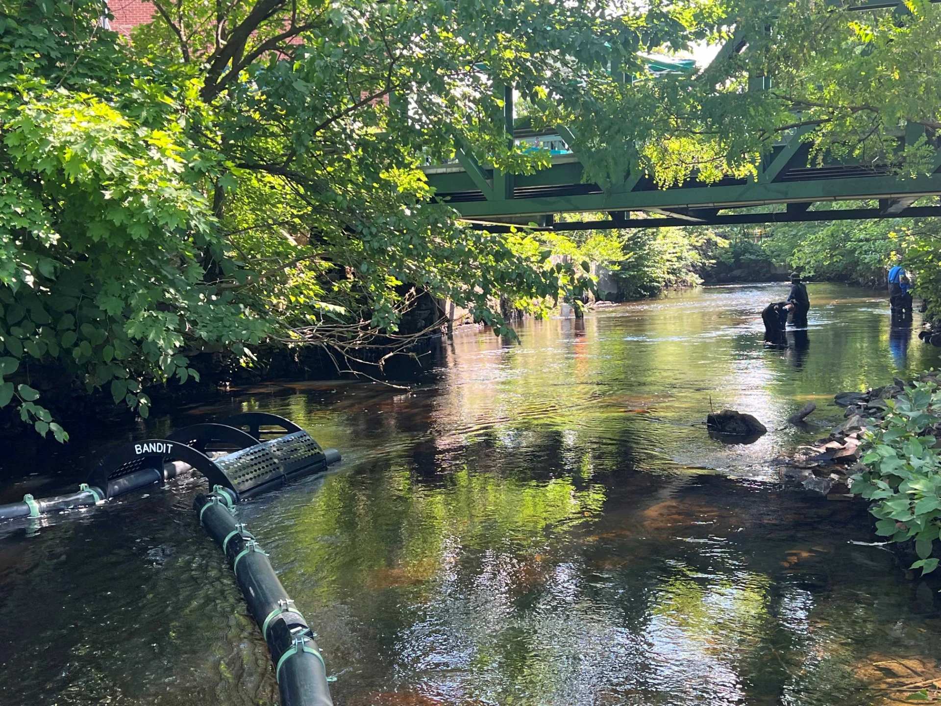 Woonasquatucket River Watershed Council, Cox install litter trap
