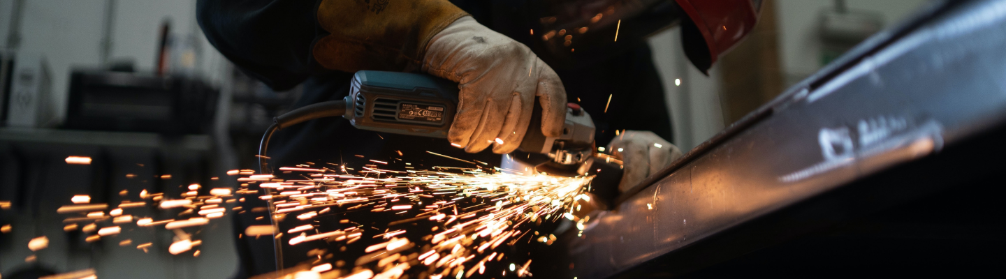 an employee welding a product