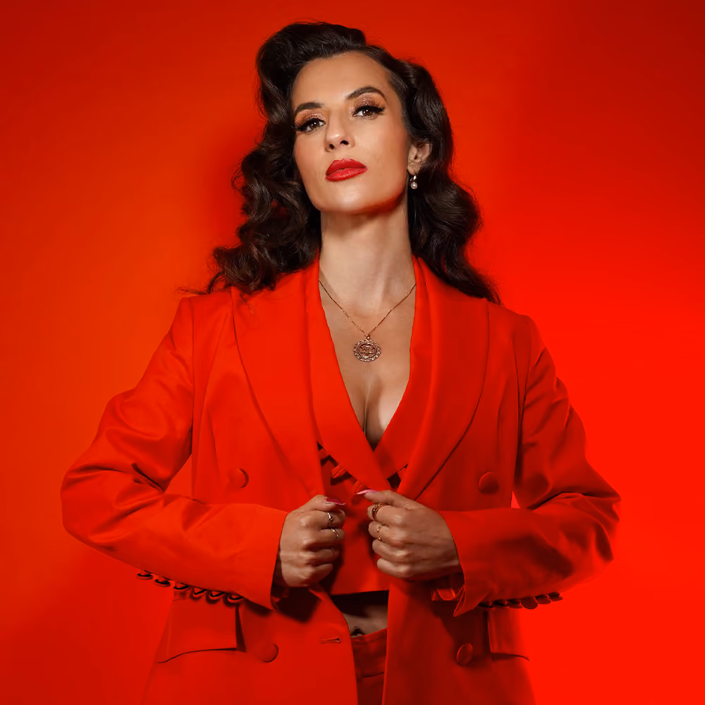 Emma Smith in a red suit