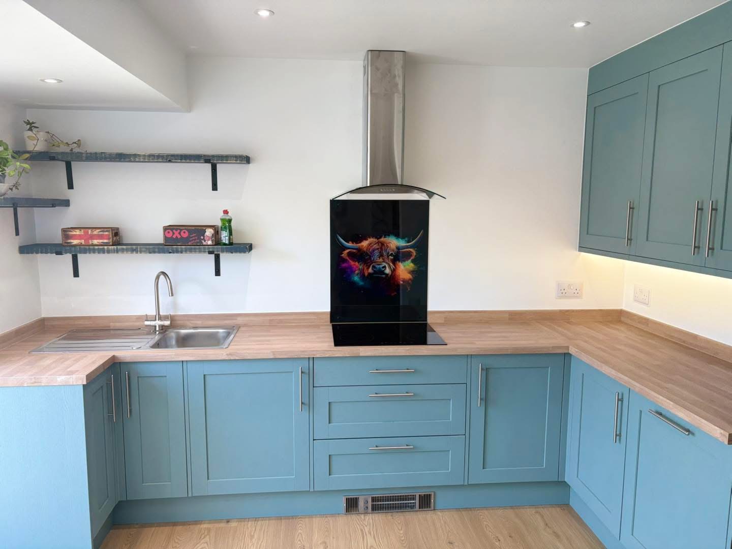 Kitchen refit by Handy Helpers in Bedworth, with blue cabinets and wood-effect worktops