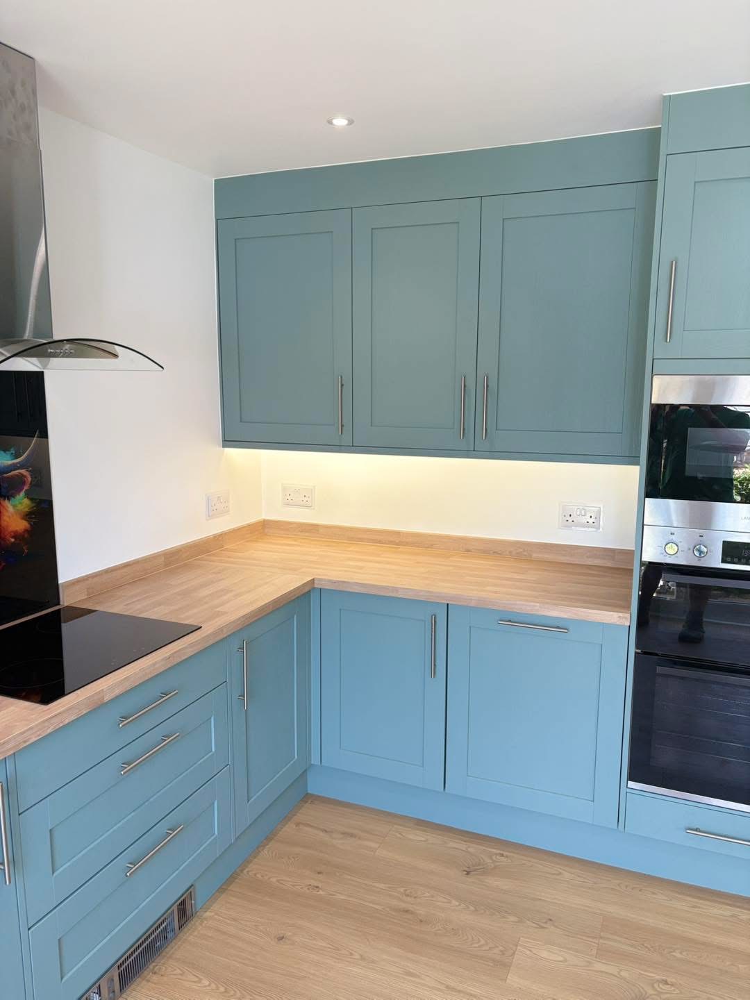 Corner cabinetry and worktop with under-cabinet lighting