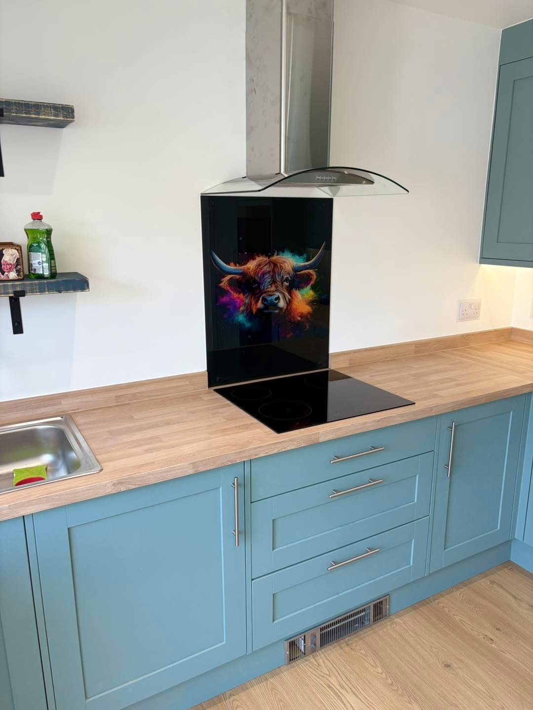 Hob and colourful Highland cow splashback