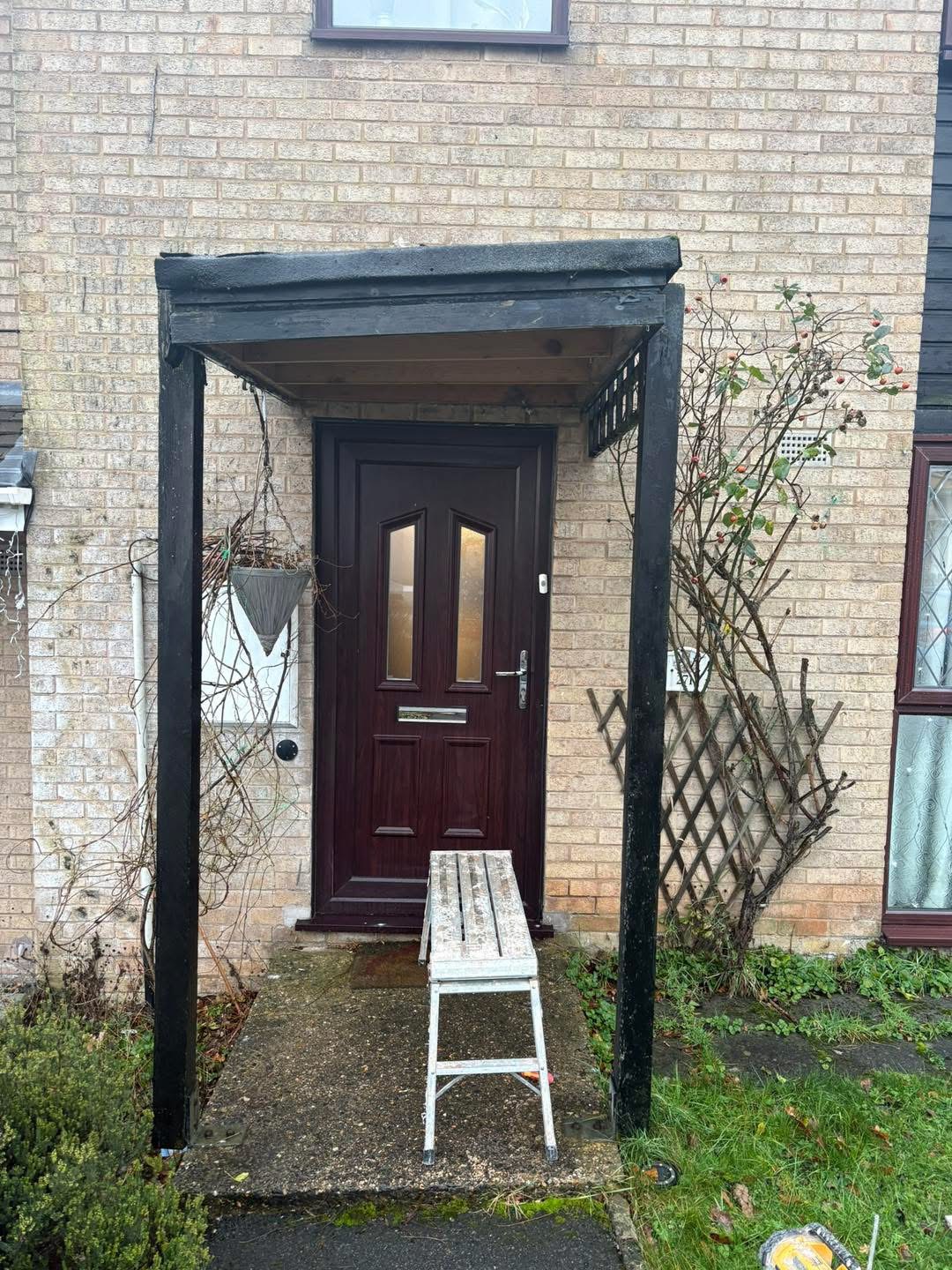 Before: the original door canopy