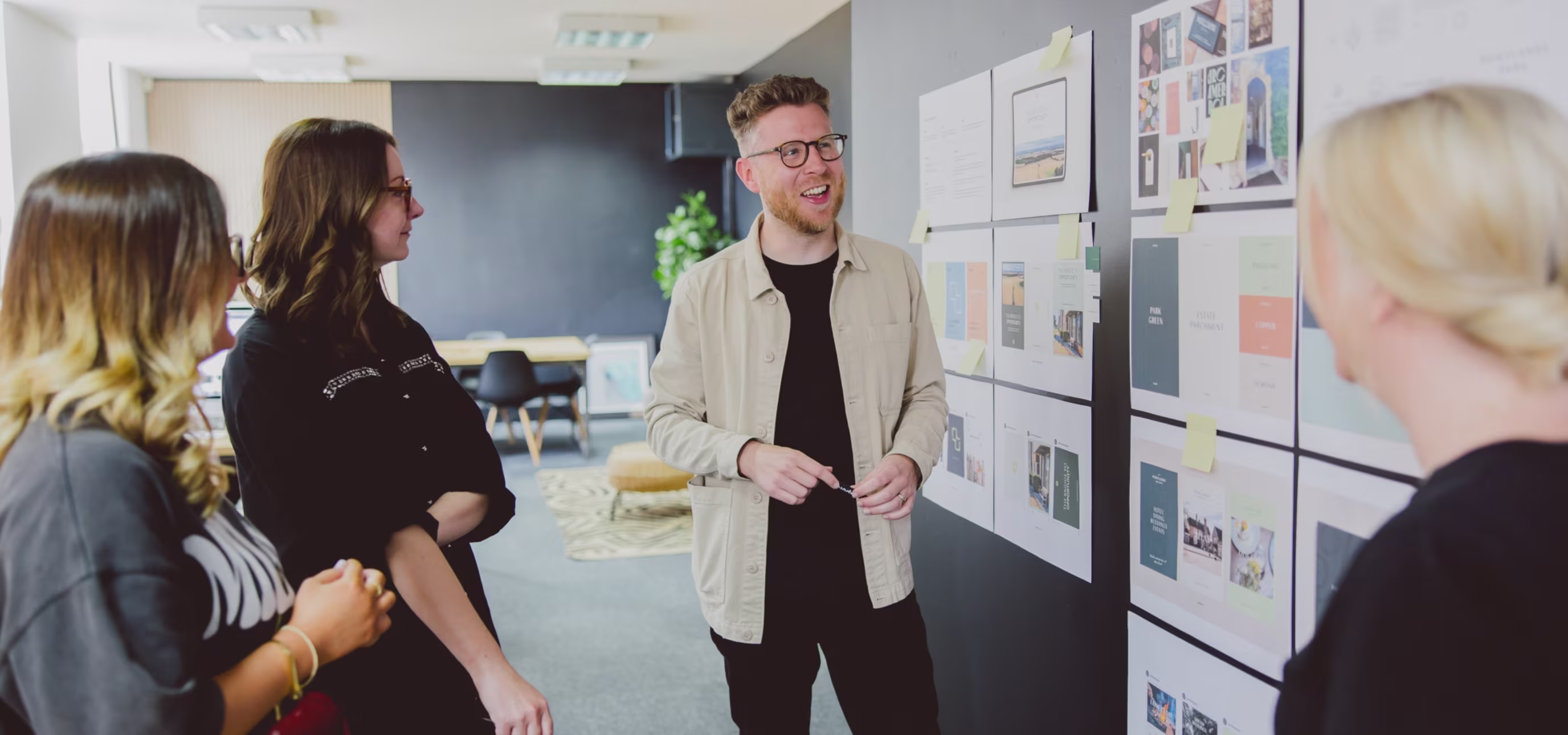 Polar team meeting in front of work pinned on the wall
