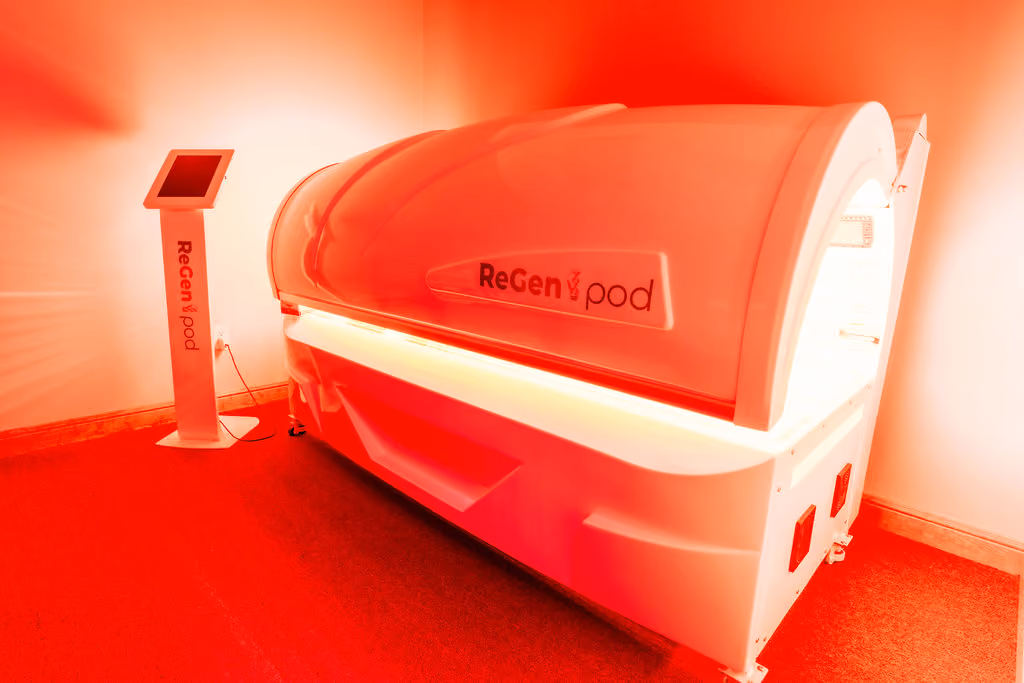 A red-light photobiomodulation pod in a NeuroBridge treatment room