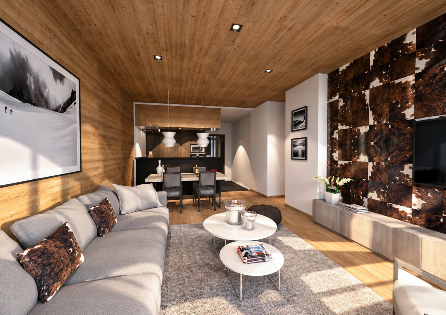 Séjour avec plafond en bois, canapé gris, mur habillé de peau de vache et coin repas en arrière-plan.