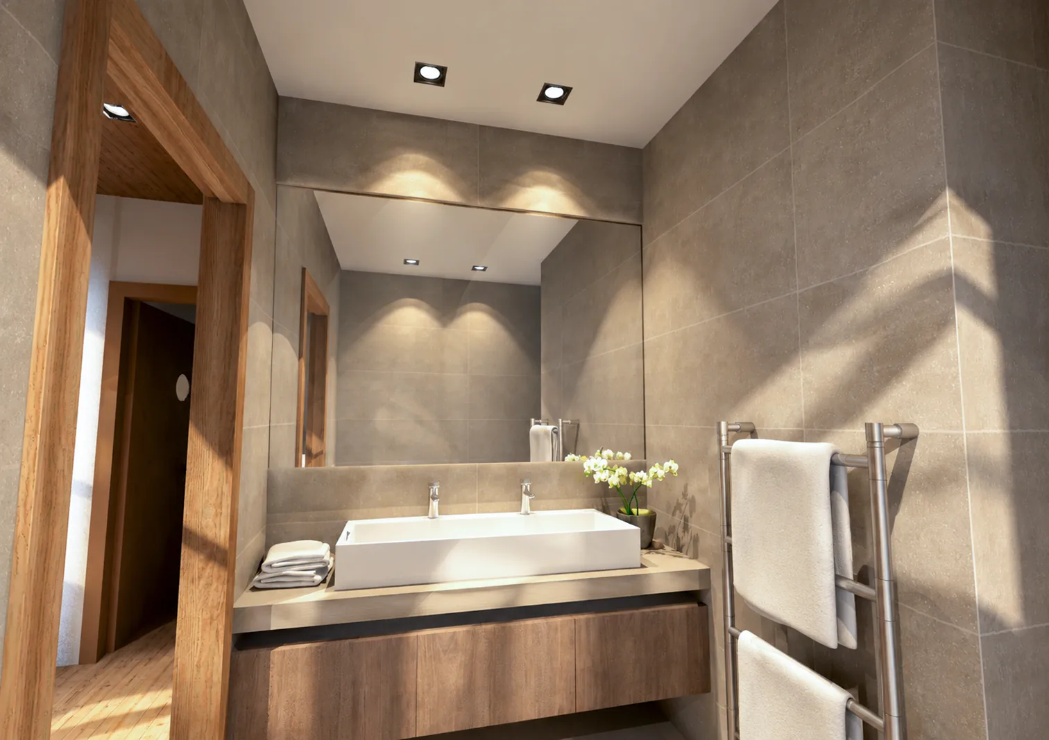 Salle de bain avec vasque blanche sur meuble en bois, grand miroir et carrelage gris grand format.