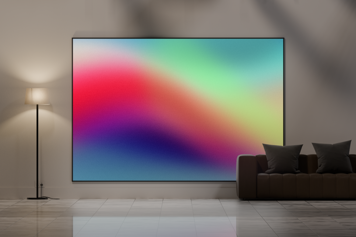 A living room with a couch and a painting on the wall.