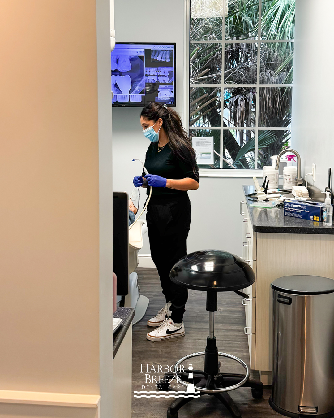 A Harbor Breeze Dental Care hygienist preparing a treatment room in Jupiter, Florida
