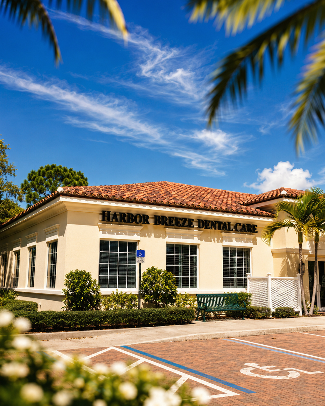Harbor Breeze Dental Care building exterior under palm trees in Jupiter, Florida
