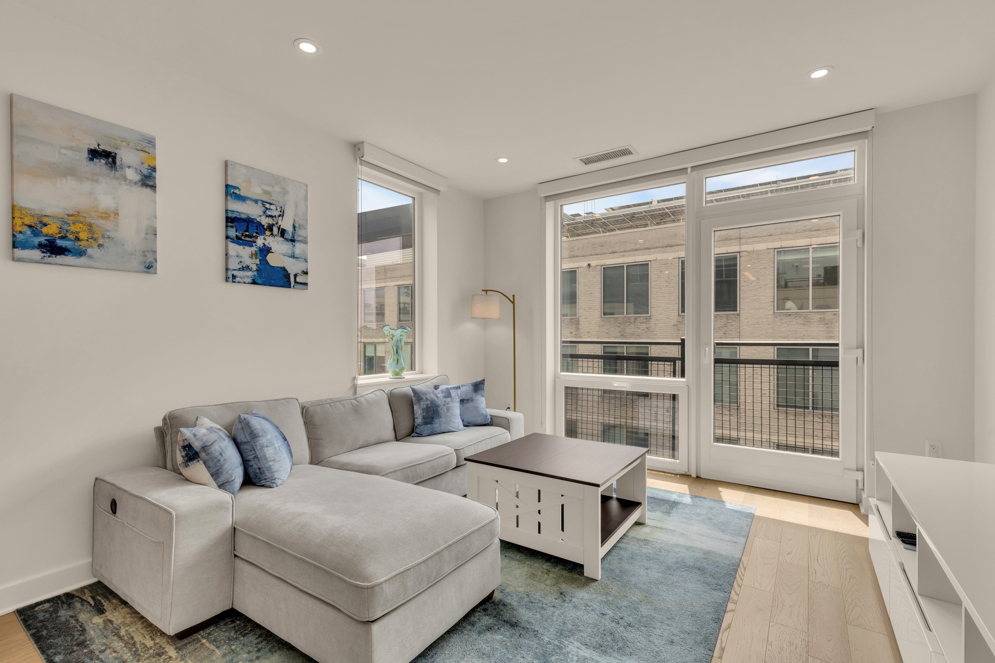 Living room with balcony at Kennedy on L #1105