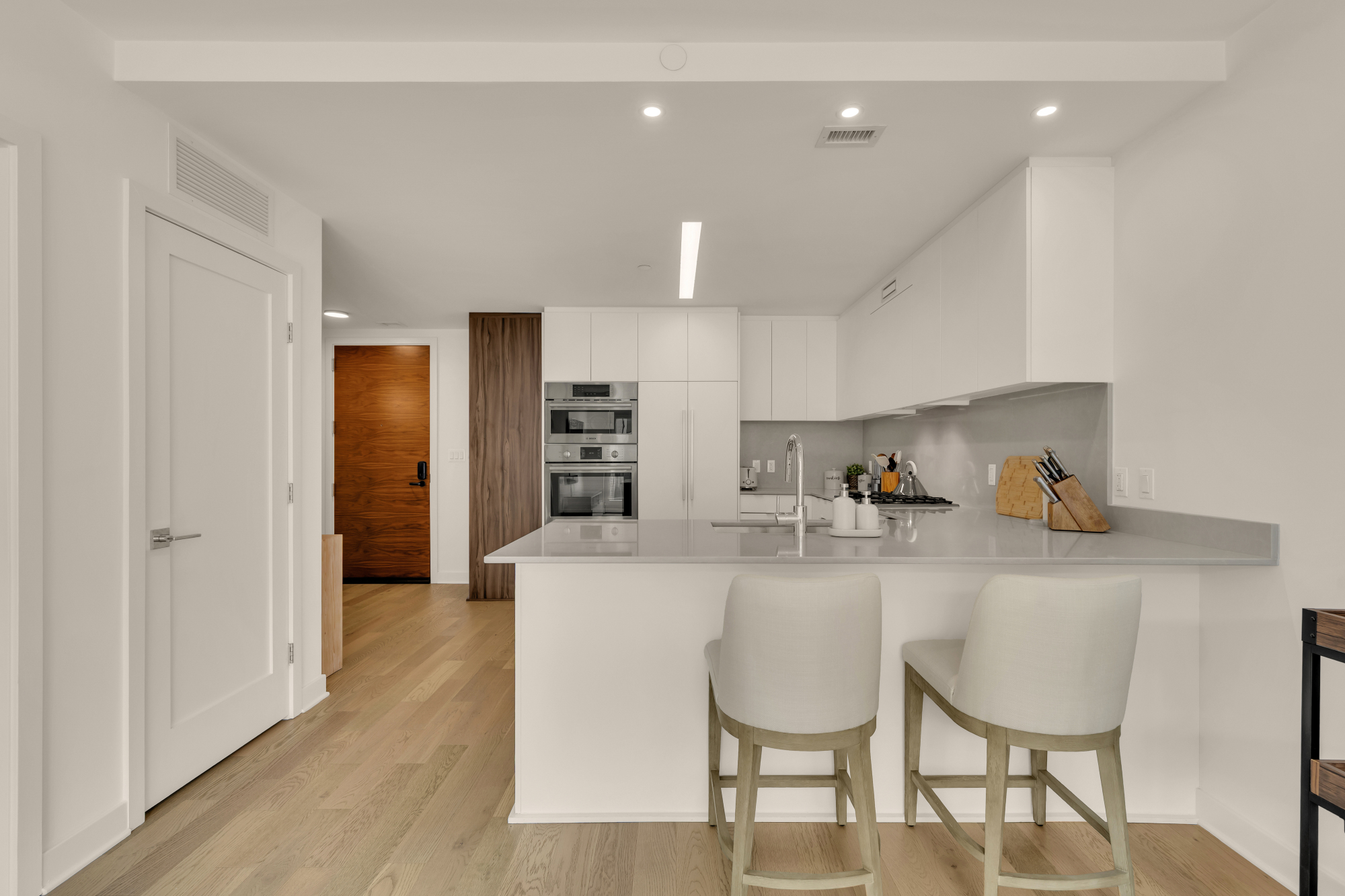 Kitchen and living area at Kennedy on L #1105