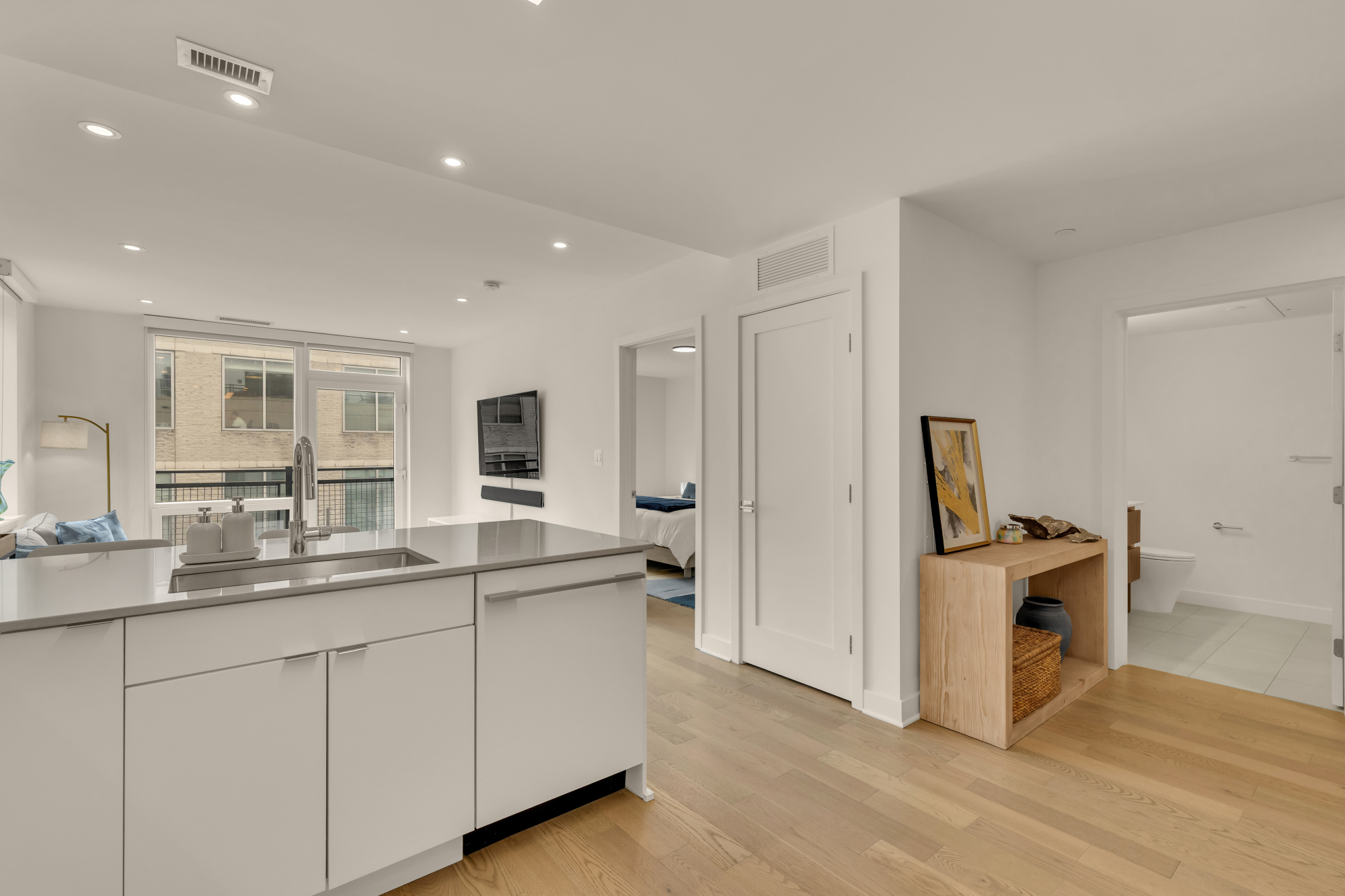 Kitchen, living area, and entry at Kennedy on L #1105