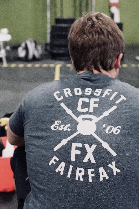 CrossFit Fairfax members heading out of the gym's garage door for an outdoor run (mobile)