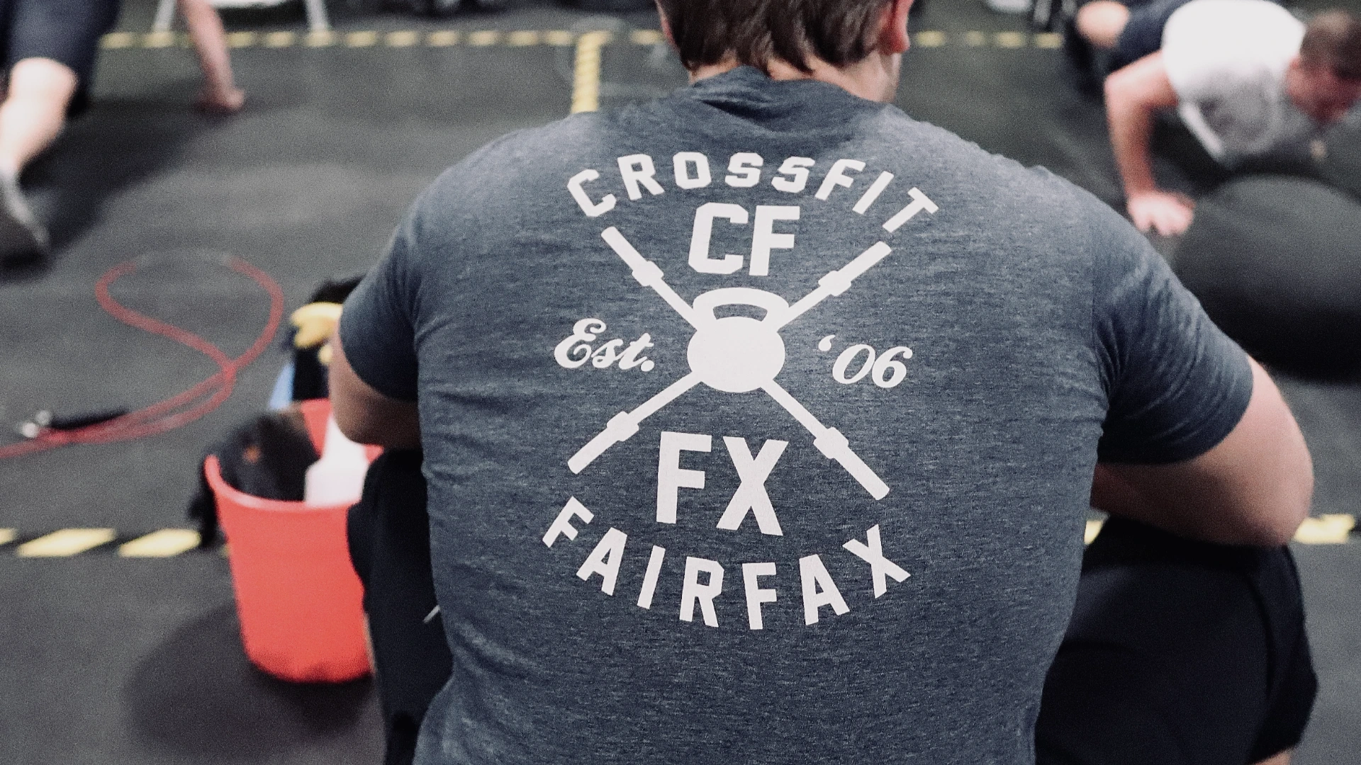 CrossFit Fairfax members heading out of the gym's garage door for an outdoor run