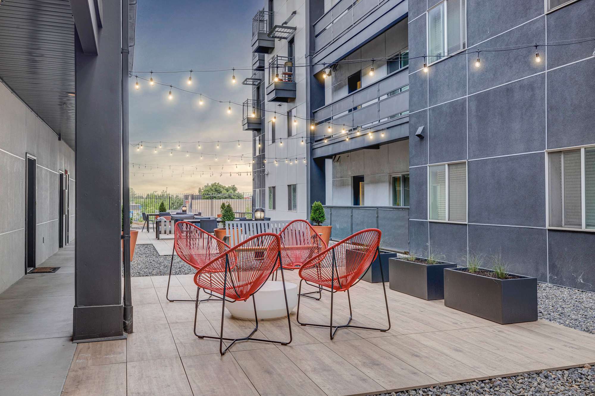 The Essex: Courtyard seating under string lights
