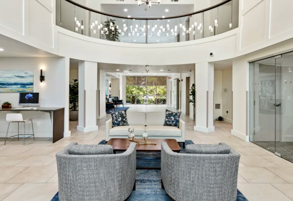 Colonial Court: Renovated lobby seating and business nook under the atrium