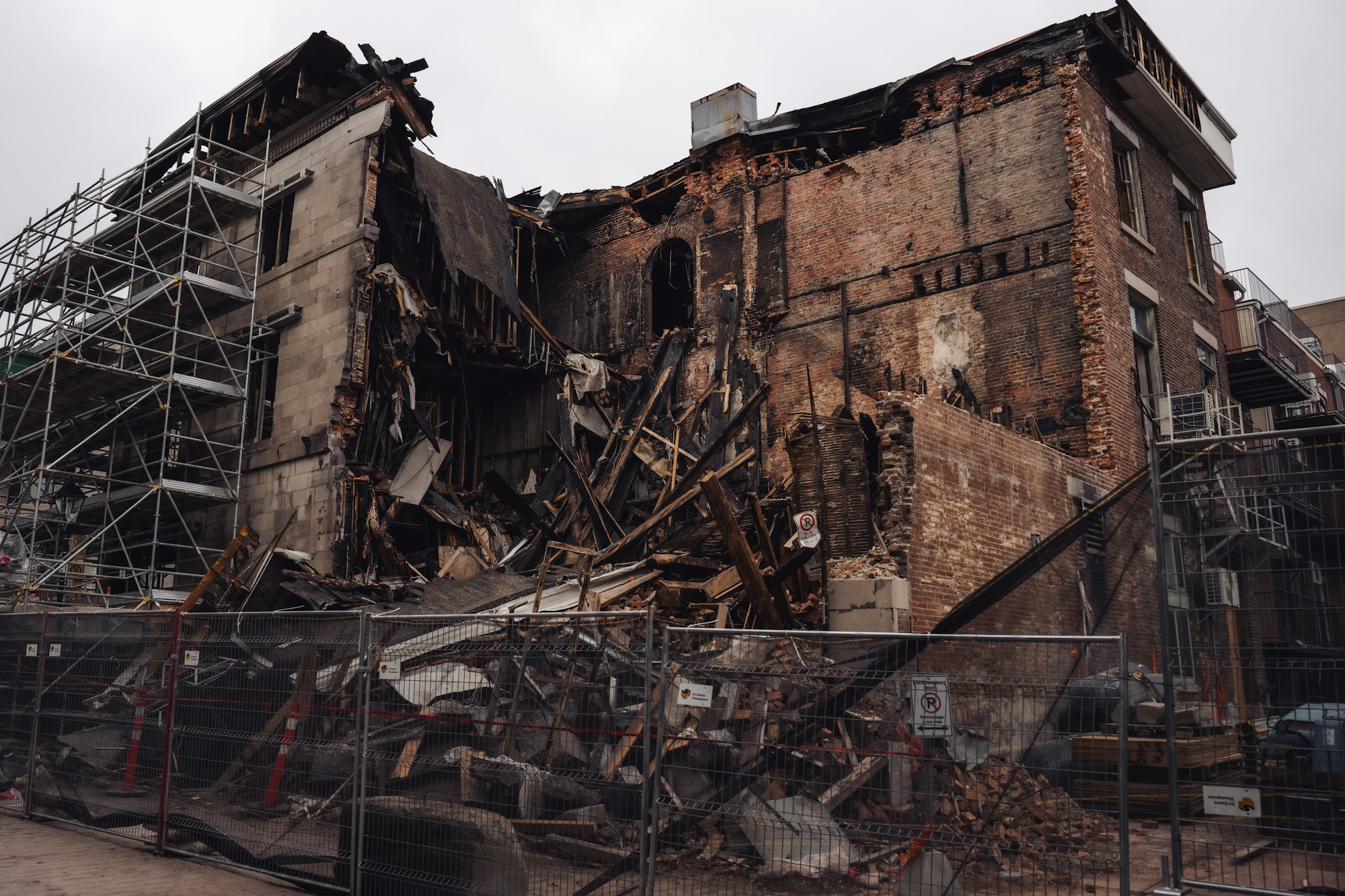 Fire-damaged multi-story building awaiting reconstruction